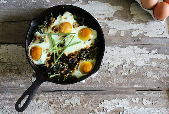 Baked Eggs with Garlic Kale and Sun-Dried Tomatoes